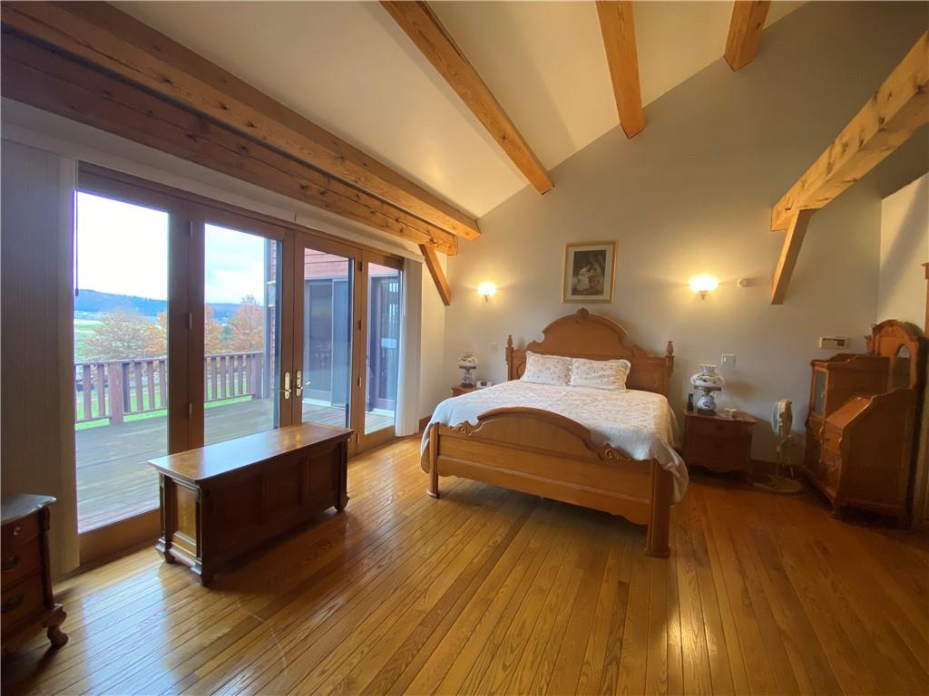 2862 West Pike Road Indiana, PA 15701 - Photo 12 of 25 a spacious bedroom with a bed and wooden floor