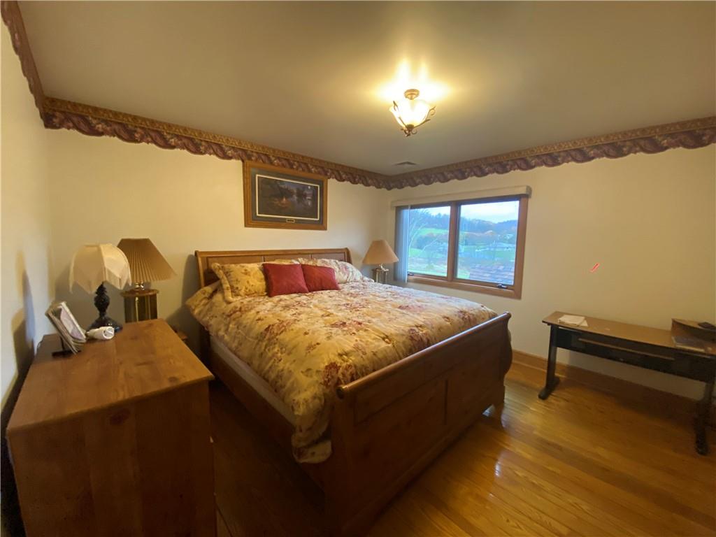 2862 West Pike Road Indiana, PA 15701 - Photo 16 of 25 a spacious bedroom with a bed and a night stand