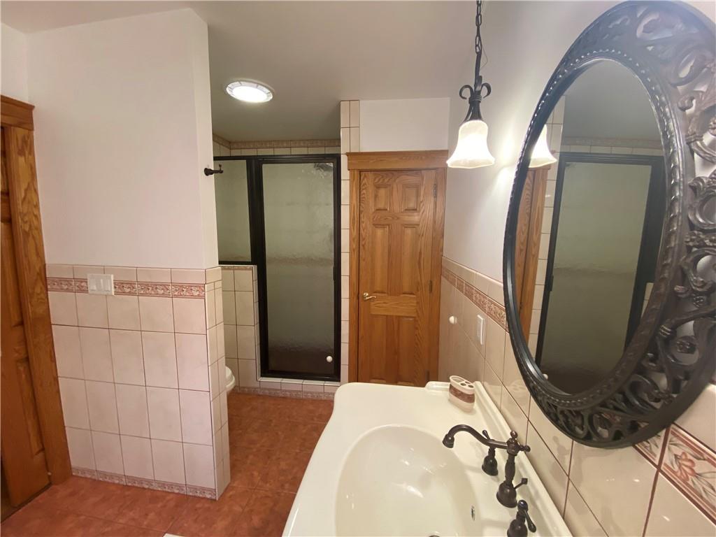 2862 West Pike Road Indiana, PA 15701 - Photo 18 of 25 a bathroom with a sink and a mirror