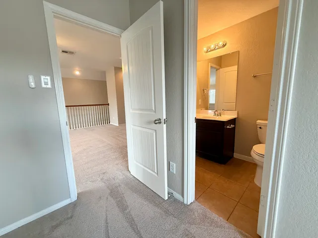 view of a bathroom with a sink and a mirror