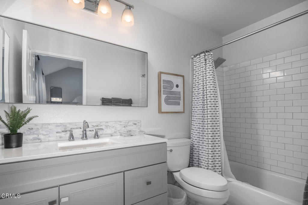 1035 Arroyo Verde Road, Unit B South Pasadena, CA 91030 - Photo 12 of 12 a bathroom with a sink a toilet a mirror and shower
