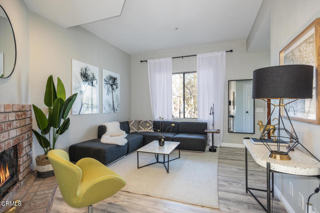 1035 Arroyo Verde Road, Unit B South Pasadena, CA 91030 - Photo 2 of 12 a living room with furniture a window and a flat screen tv