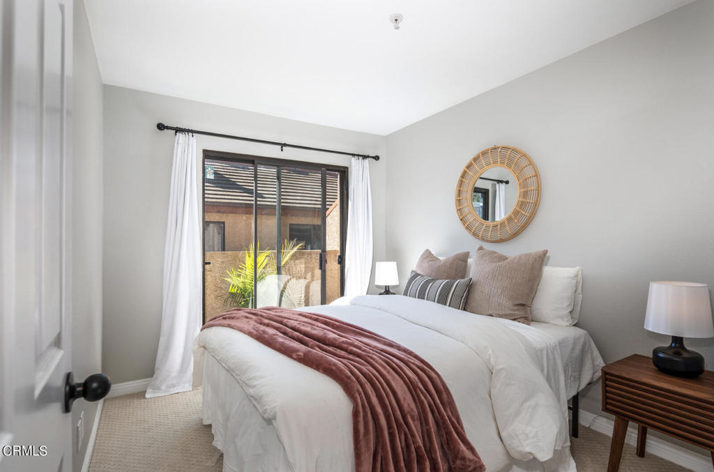 1035 Arroyo Verde Road, Unit B South Pasadena, CA 91030 - Photo 8 of 12 a bedroom with a bed and a painting on the wall