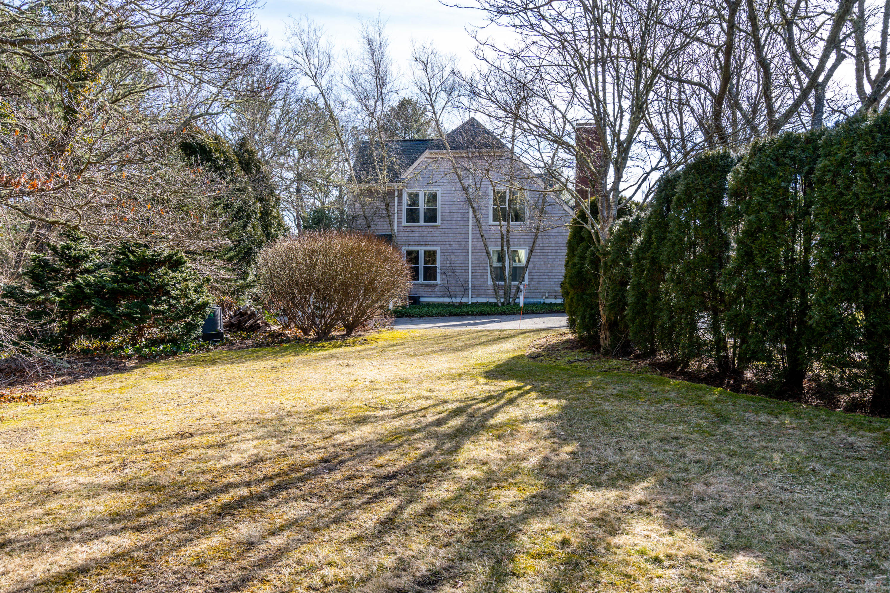 10 Bob White Crescent Mashpee, MA 02649 - Photo 27 of 28 a view of a house with a yard covered with snow