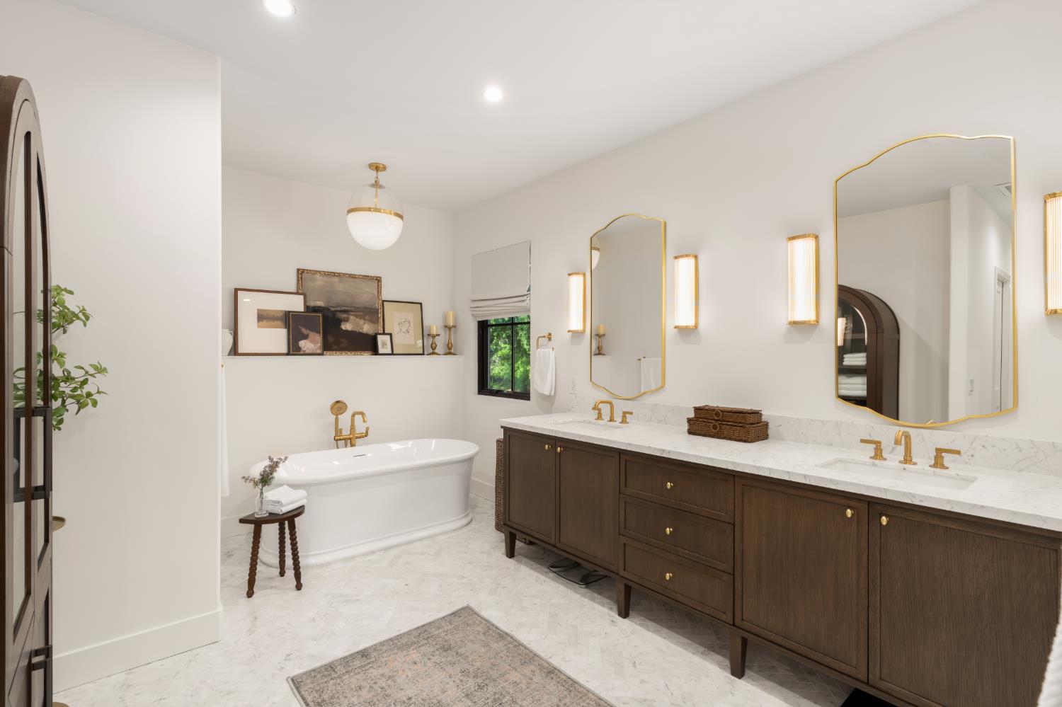 7697 Horseshoe Bar Road Loomis, CA 95650 - Photo 27 of 76 a bathroom with a double vanity sink mirror and bathtub