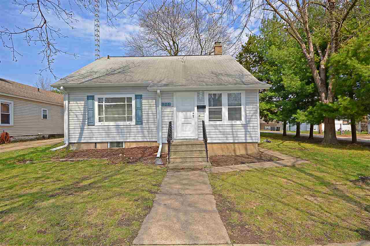 523 10th Avenue Rochelle, IL 61068 - Photo 1 of 22 a front view of a house with a yard
