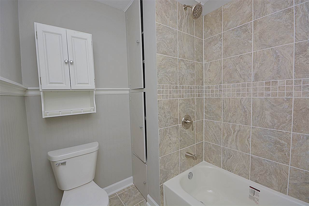 523 10th Avenue Rochelle, IL 61068 - Photo 13 of 22 a bathroom with a toilet and shower