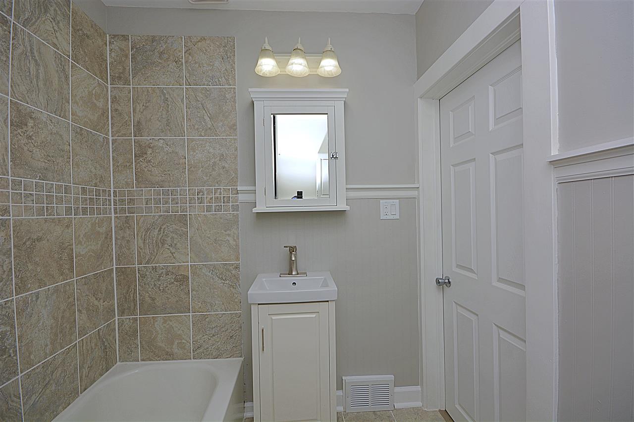 523 10th Avenue Rochelle, IL 61068 - Photo 14 of 22 a bathroom with a sink a toilet and shower