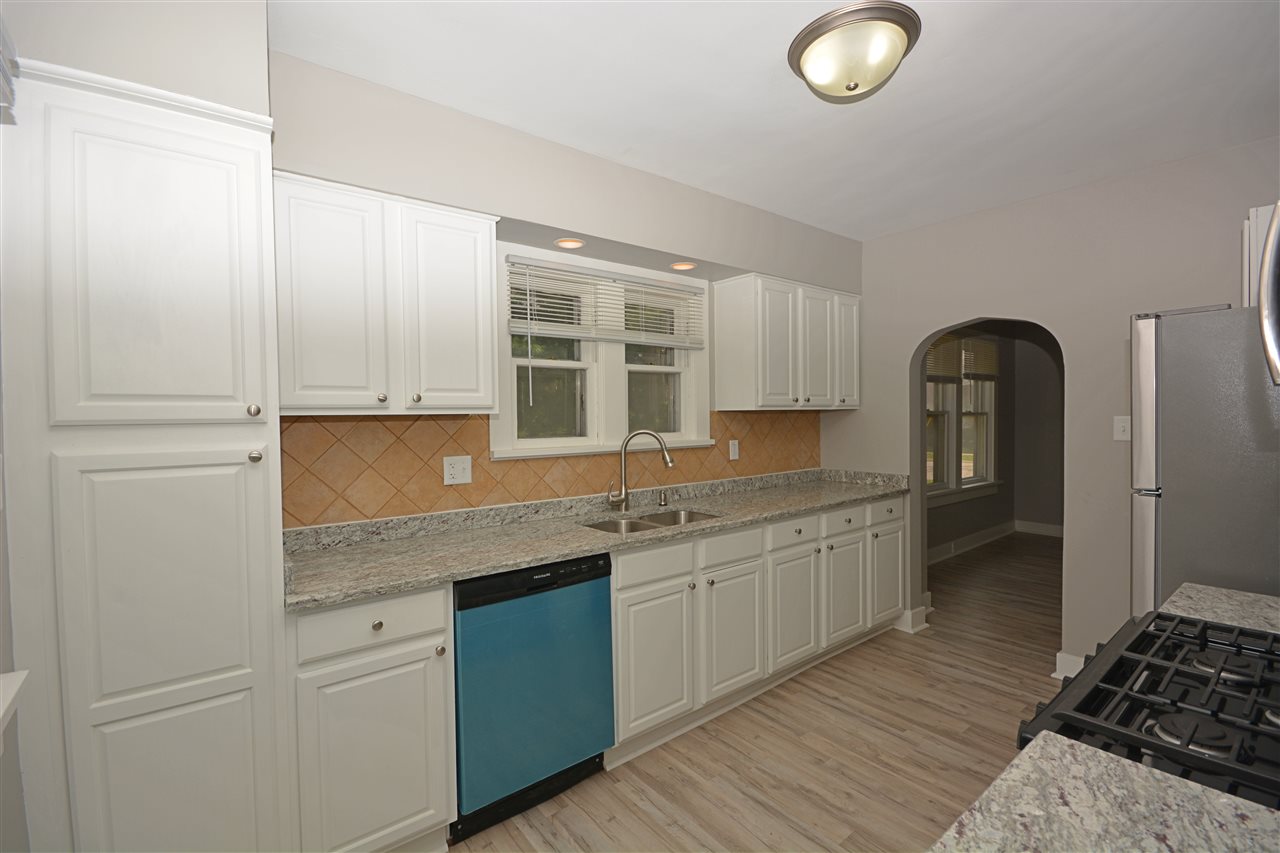523 10th Avenue Rochelle, IL 61068 - Photo 9 of 22 a kitchen with granite countertop a sink stainless steel appliances and cabinets