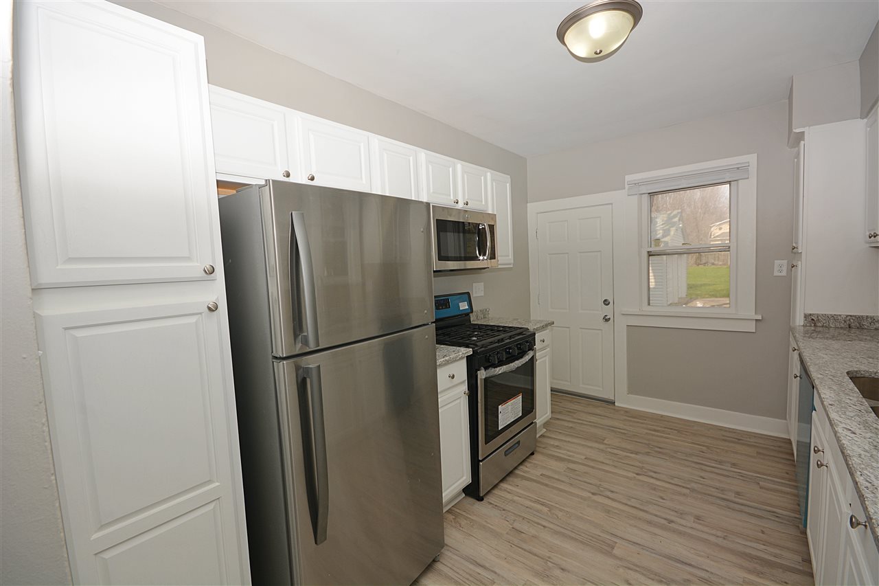 523 10th Avenue Rochelle, IL 61068 - Photo 10 of 22 a metallic refrigerator freezer sitting in a kitchen