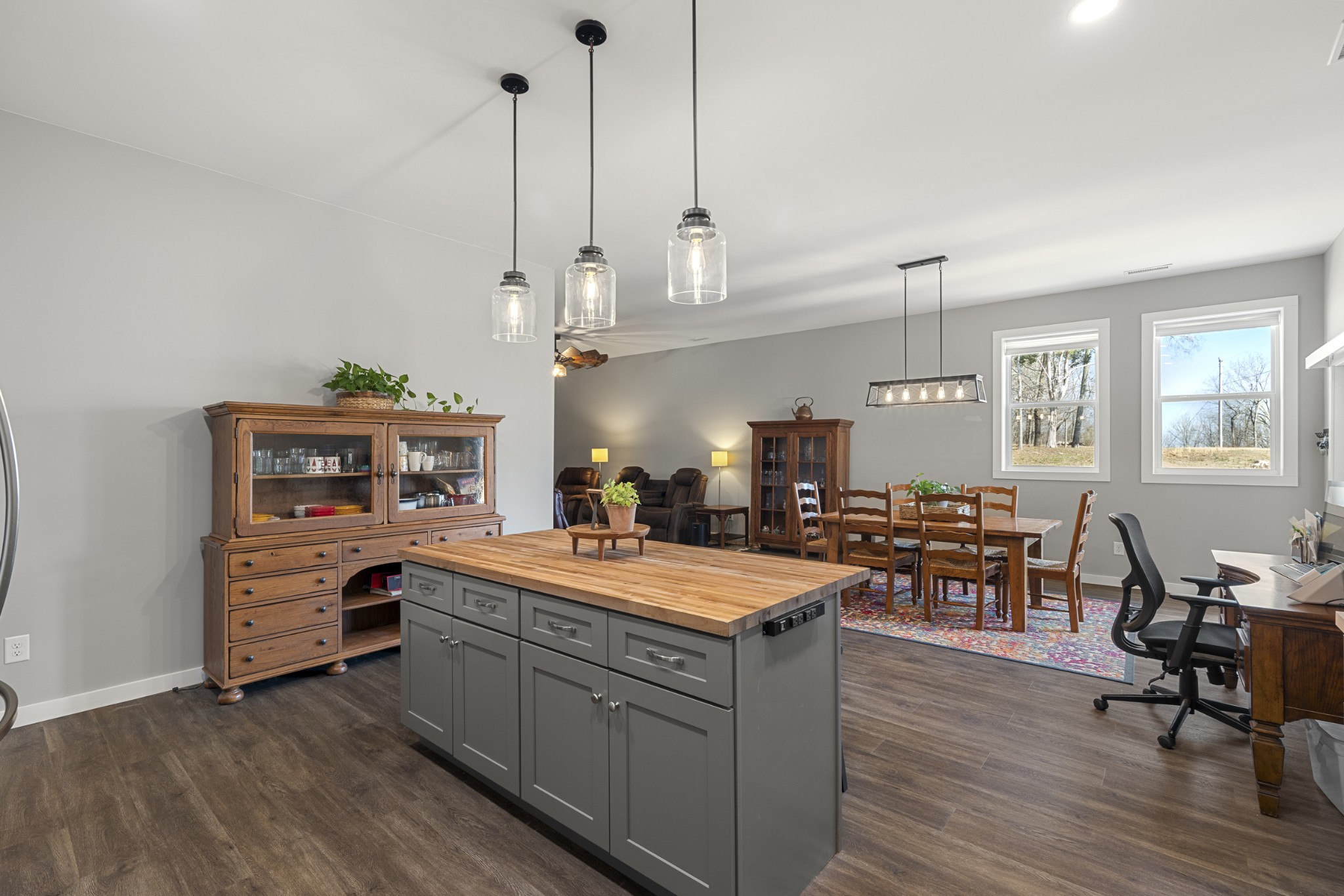 3363 Ridge Road Columbia, TN 38401 - Photo 7 of 43 a large kitchen with kitchen island a stove a sink a dining table and chairs with wooden floor