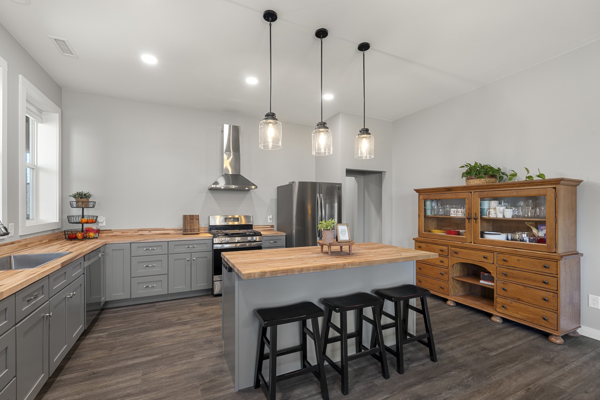 3363 Ridge Road Columbia, TN 38401 - Photo 10 of 43 a kitchen with a stove a sink and wooden floor