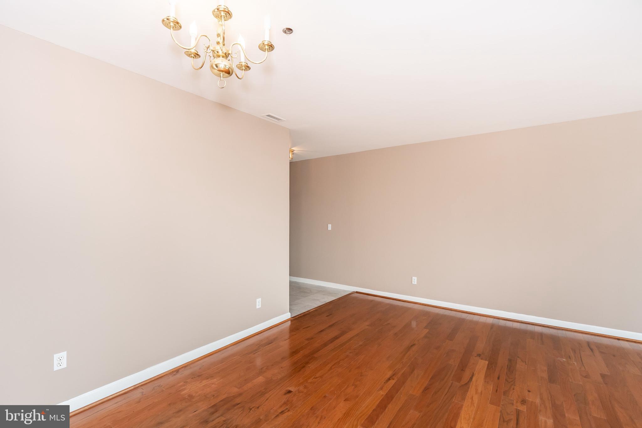 100 Harborview Drive, Unit 1908 Baltimore, MD 21230 - Photo 14 of 60 a view of a room with wooden floor