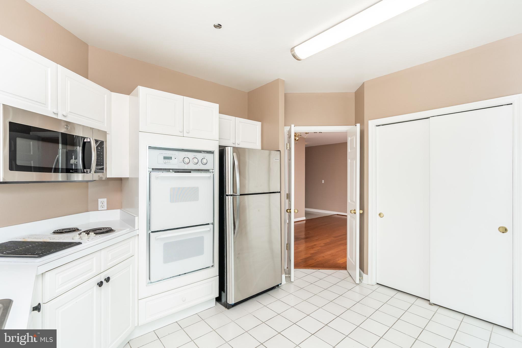 100 Harborview Drive, Unit 1908 Baltimore, MD 21230 - Photo 18 of 60 a kitchen with stainless steel appliances a refrigerator sink and microwave