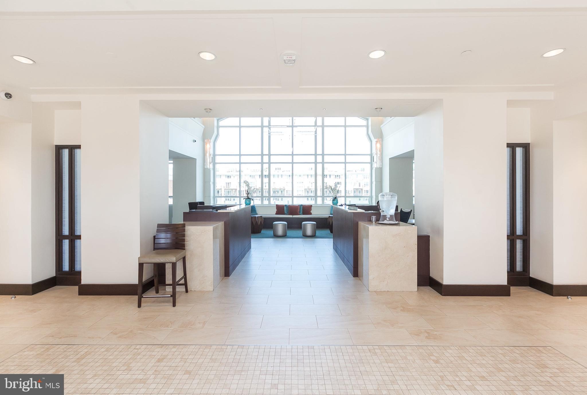 100 Harborview Drive, Unit 1908 Baltimore, MD 21230 - Photo 3 of 60 a living room with furniture and a window