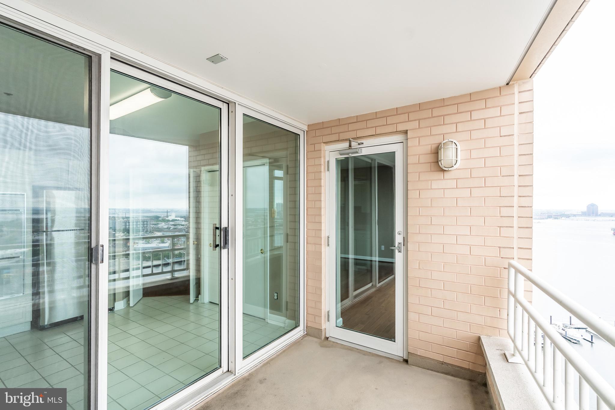 100 Harborview Drive, Unit 1908 Baltimore, MD 21230 - Photo 31 of 60 a view of a glass door and an entryway