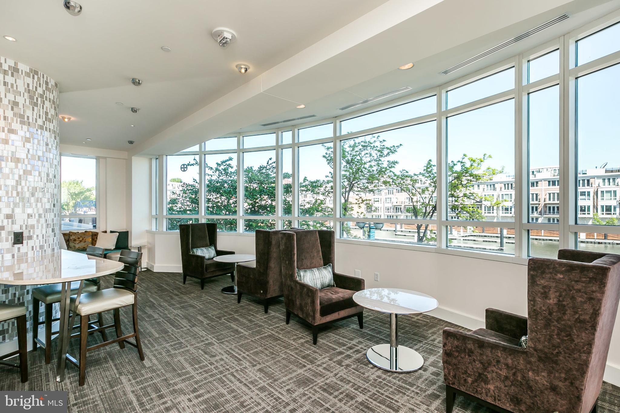 100 Harborview Drive, Unit 1908 Baltimore, MD 21230 - Photo 40 of 60 a living room with furniture and a large window