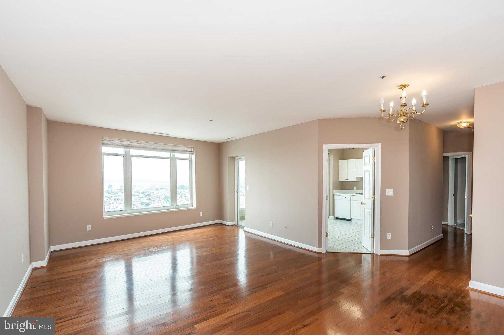 100 Harborview Drive, Unit 1908 Baltimore, MD 21230 - Photo 7 of 60 wooden floor in an empty room with a window