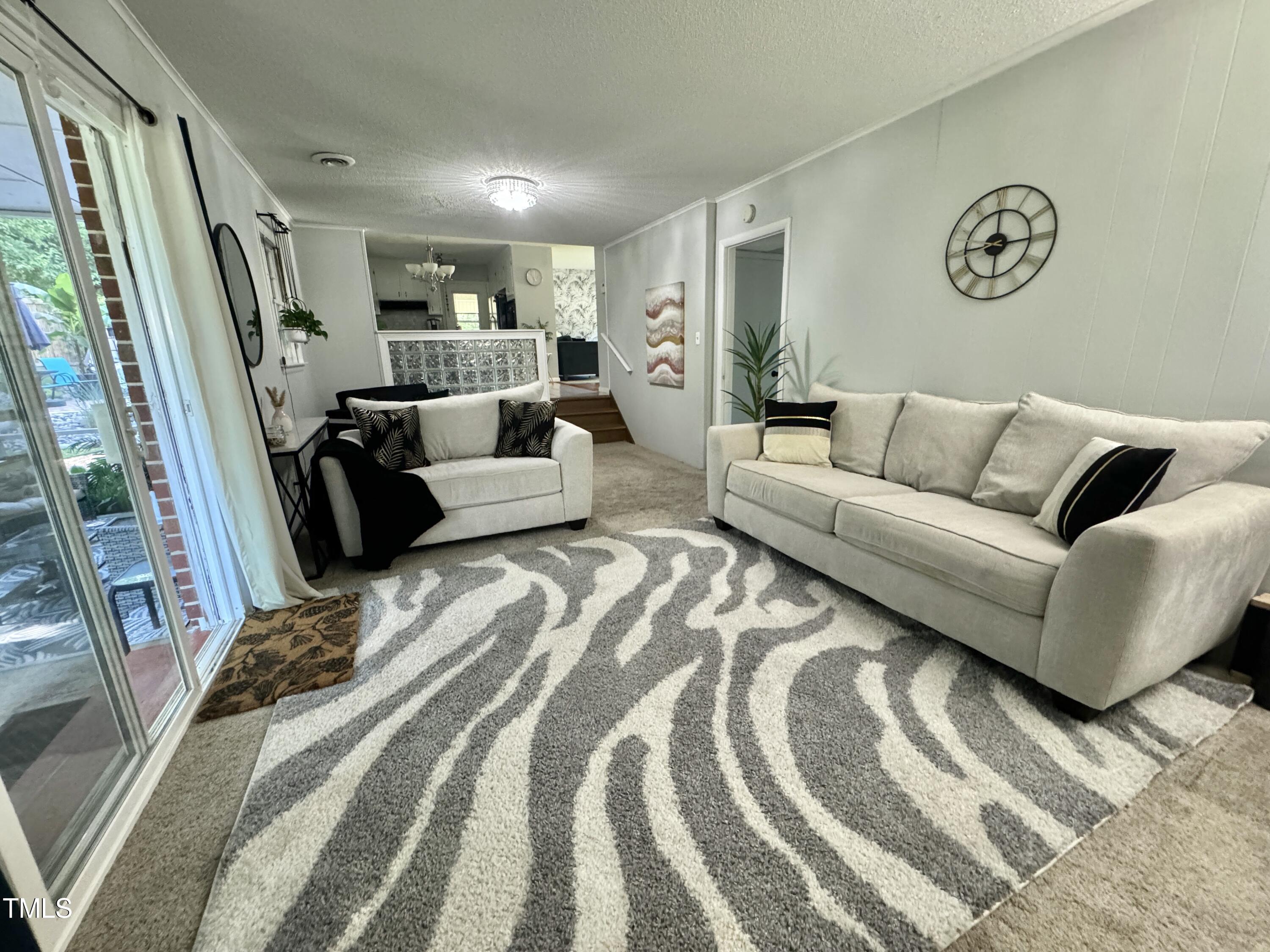 4013 Ingram Drive Raleigh, NC 27604 - Photo 12 of 29 a bed room with a bed couch and a window