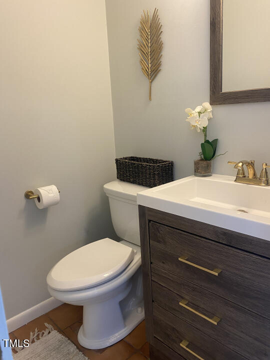 4013 Ingram Drive Raleigh, NC 27604 - Photo 14 of 29 a bathroom with a toilet and a sink