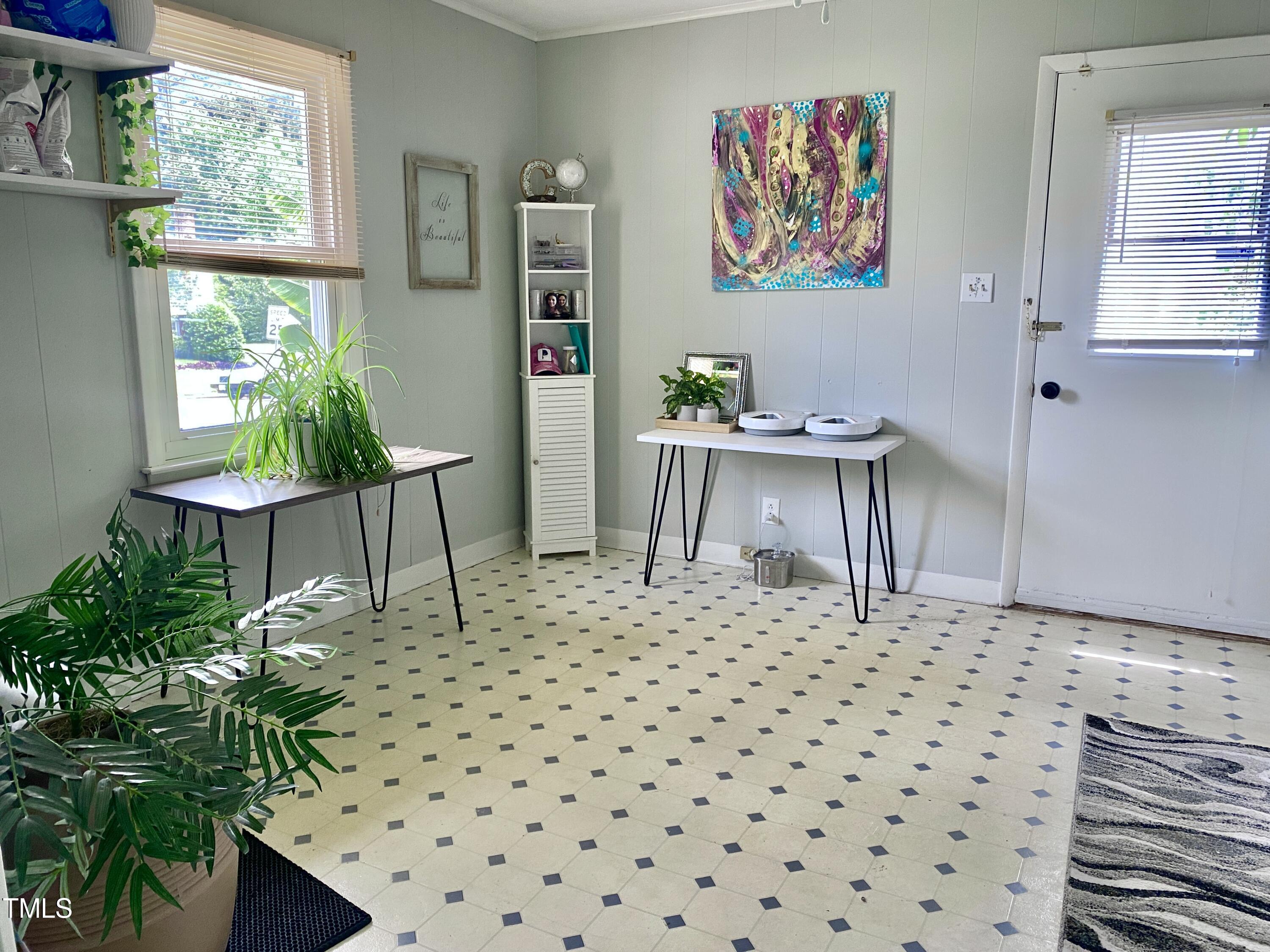 4013 Ingram Drive Raleigh, NC 27604 - Photo 27 of 29 a living room with a couch and a table