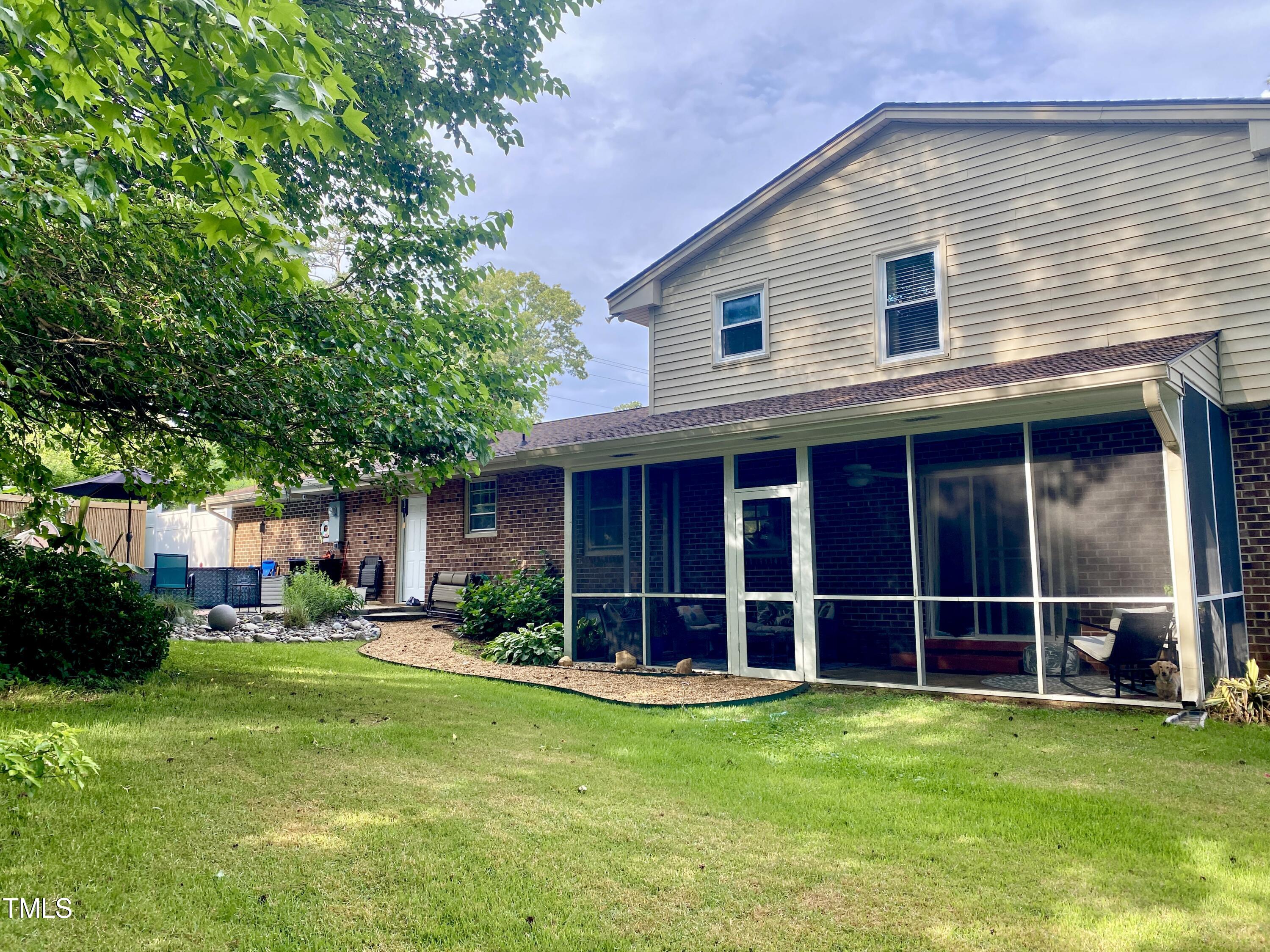 4013 Ingram Drive Raleigh, NC 27604 - Photo 28 of 29 a view of an house with backyard space and garden