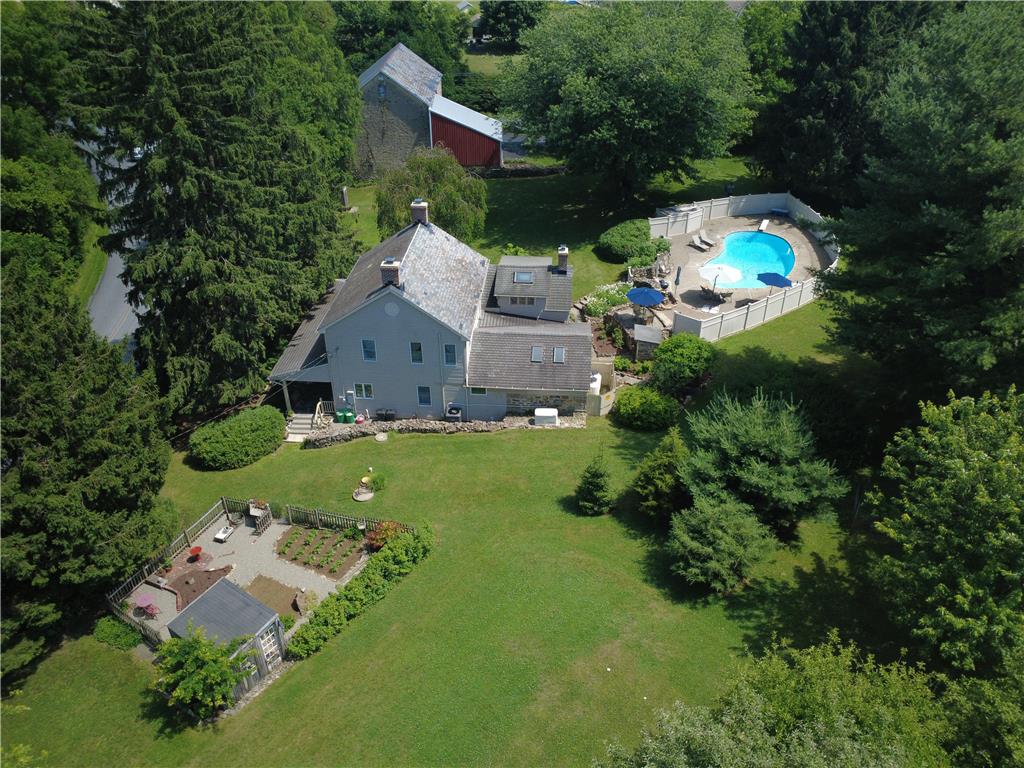 585 Buttermilk Road Hellertown, PA 18055 - Photo 81 of 82 An aerial perspective reveals a serene property featuring a private pool, extensive yard, and cultivated garden.