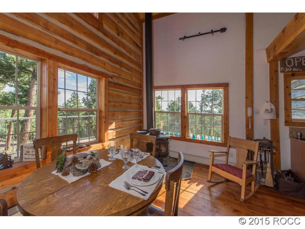 993 Bellows Road Hartsel, CO 80449 - Photo 13 of 24 a living room with furniture and a large window