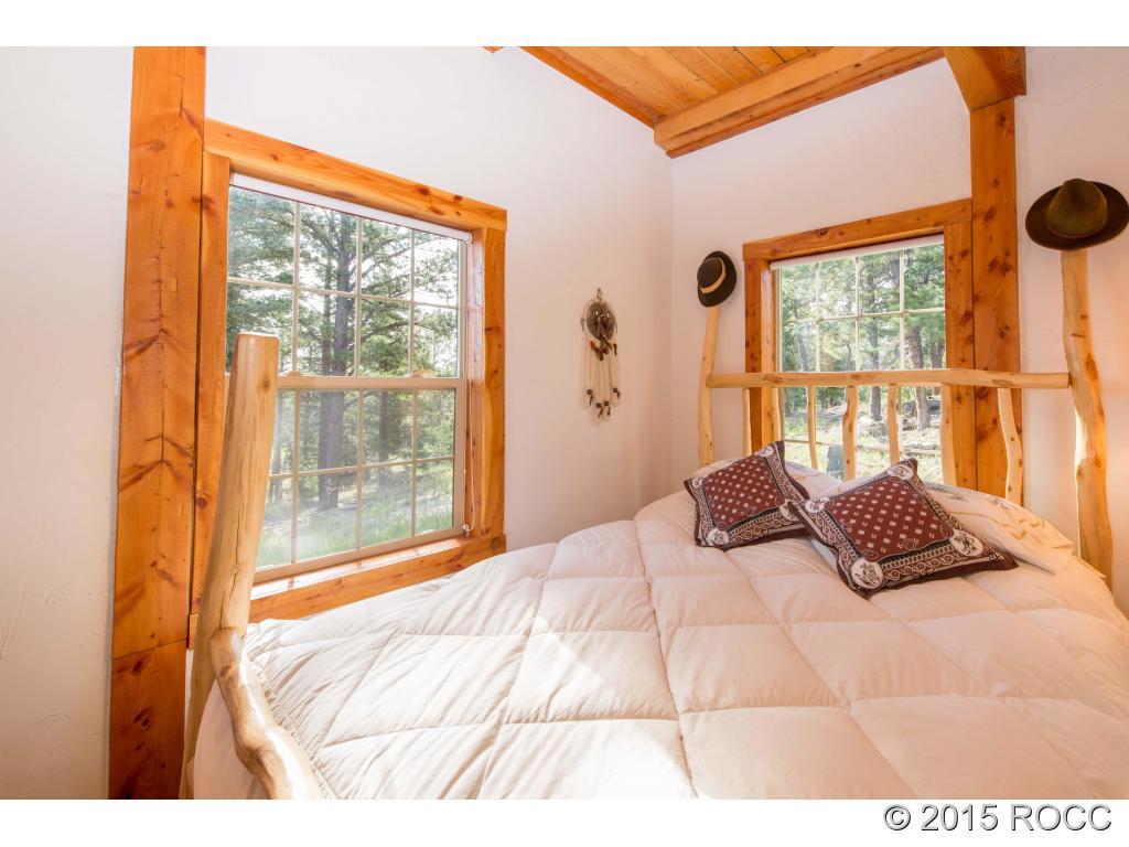 993 Bellows Road Hartsel, CO 80449 - Photo 17 of 24 a bedroom with a bed and a window