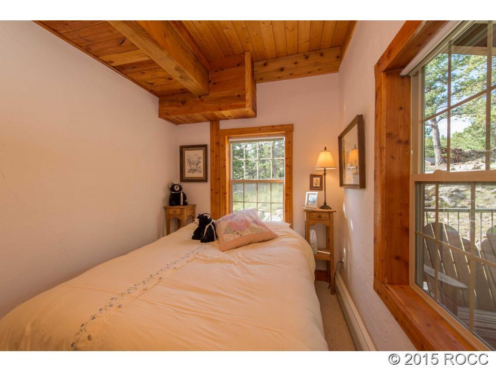 993 Bellows Road Hartsel, CO 80449 - Photo 19 of 24 a bed room with a bed and a large window