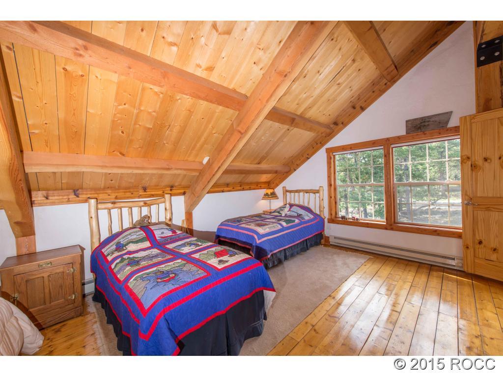 993 Bellows Road Hartsel, CO 80449 - Photo 22 of 24 a bedroom with furniture and wooden floor