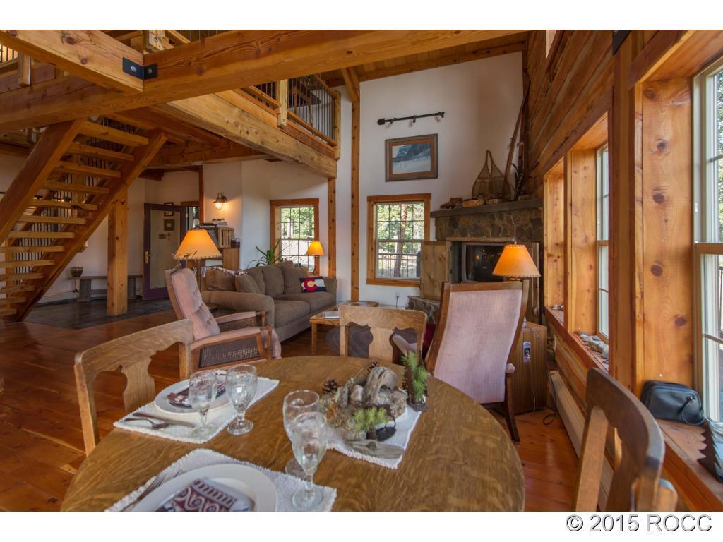 993 Bellows Road Hartsel, CO 80449 - Photo 4 of 24 a view of a living room and dining area with furniture