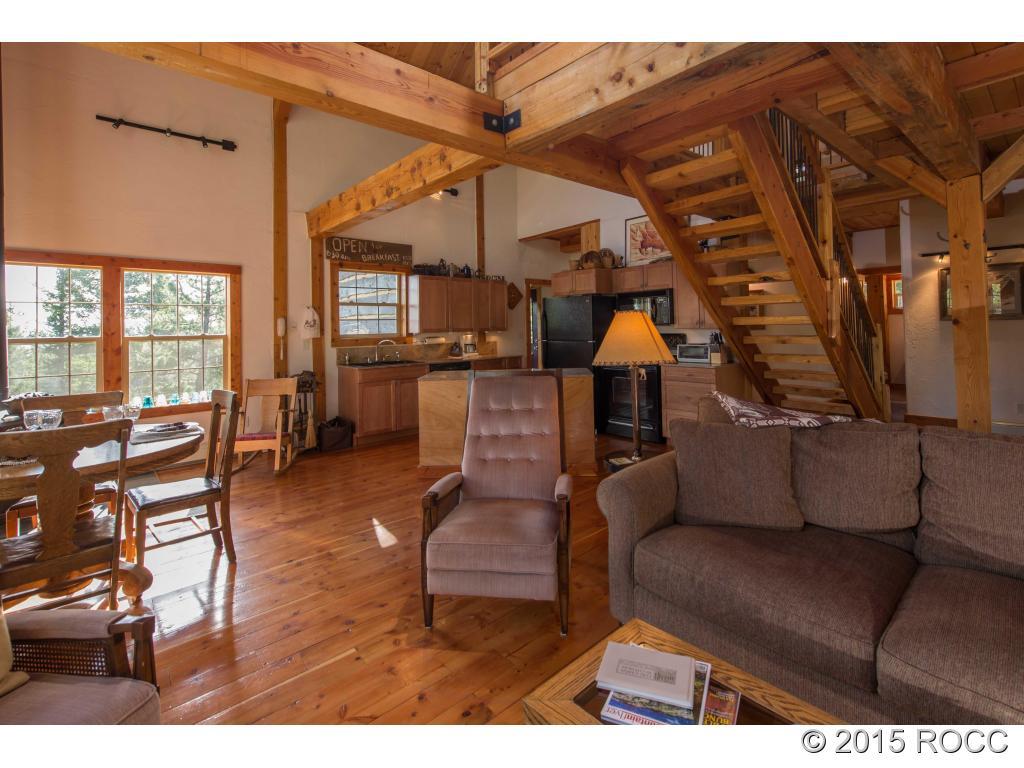 993 Bellows Road Hartsel, CO 80449 - Photo 8 of 24 a living room with furniture and a fireplace