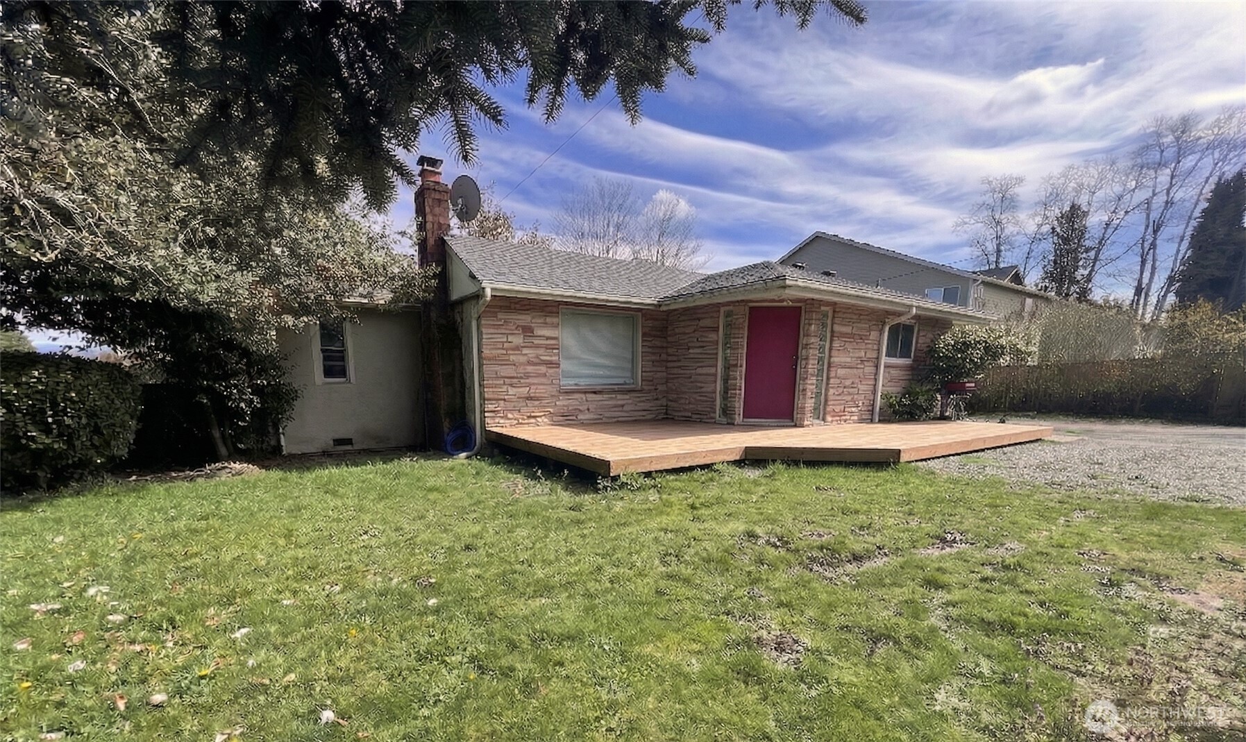 13404 Military Road South Tukwila, WA 98168 - Photo 2 of 10 a front view of a house with garden