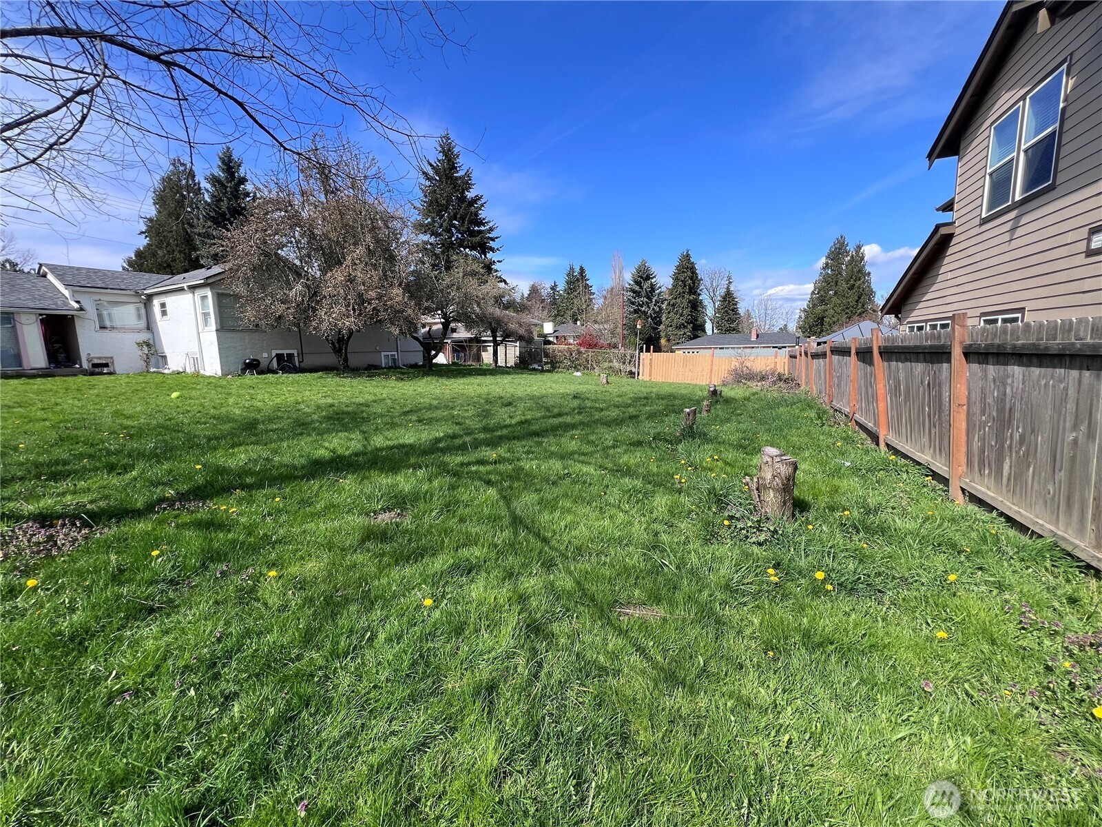 13404 Military Road South Tukwila, WA 98168 - Photo 7 of 10 a view of a house with a backyard
