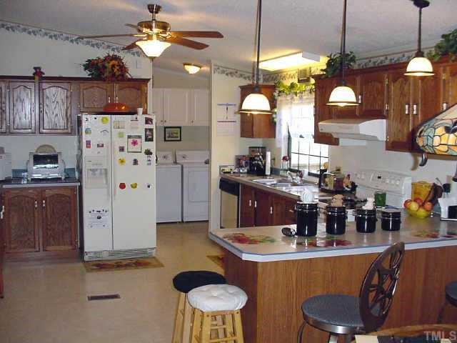 233 Hawks Road Norlina, NC 27563 - Photo 5 of 10 Massive kitchen with plenty of cabinets and countertop space!!