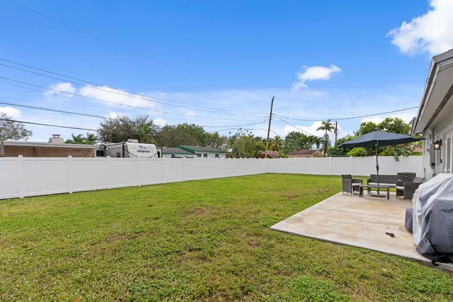 a front view of a house with yard