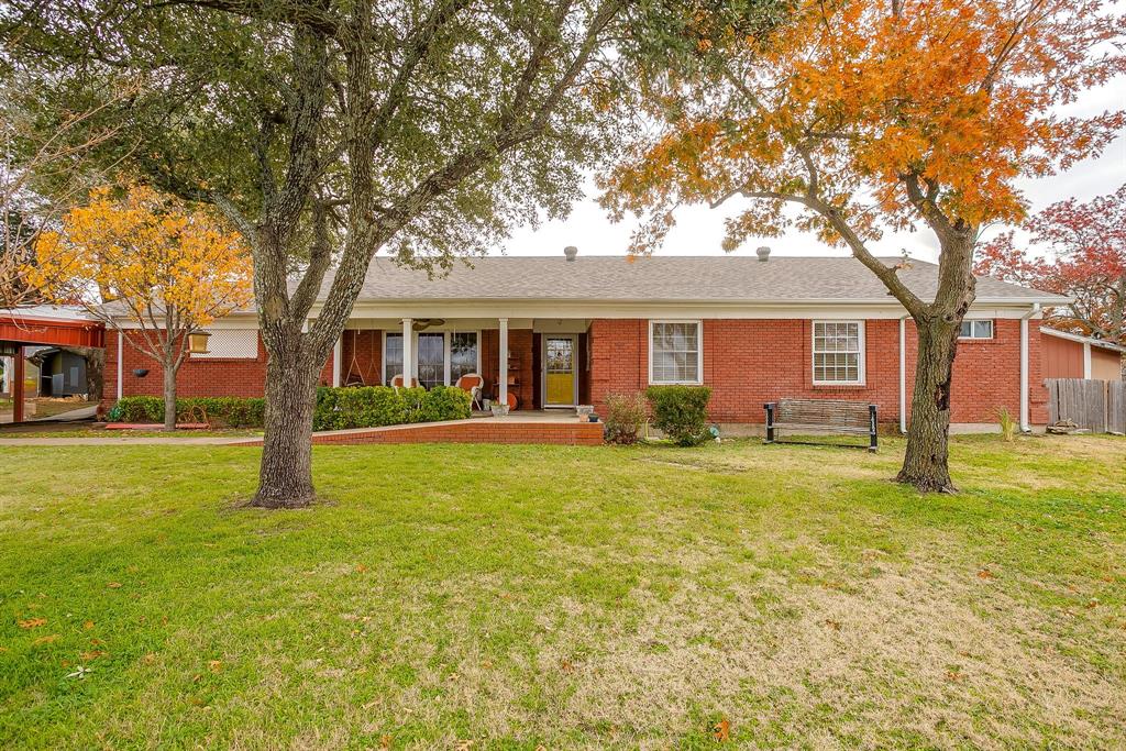 front view of a house with a yard