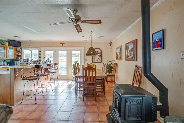 a view of a dining room with furniture and a chandelier