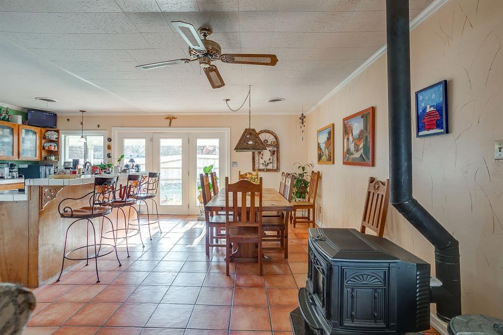 205 West Ridge Street Weatherford, TX 76086 - Photo 13 of 34 a view of a dining room with furniture and a chandelier