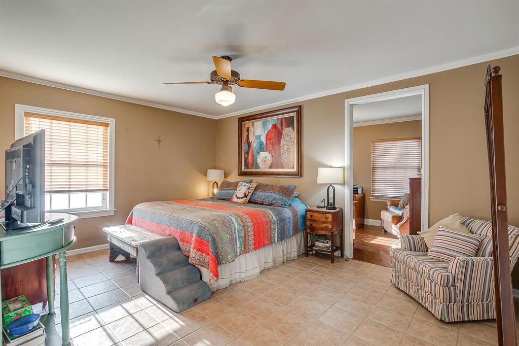 205 West Ridge Street Weatherford, TX 76086 - Photo 17 of 34 a bedroom with a bed couch and a window