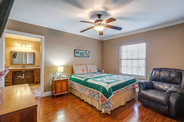 a bedroom with a bed and a couch