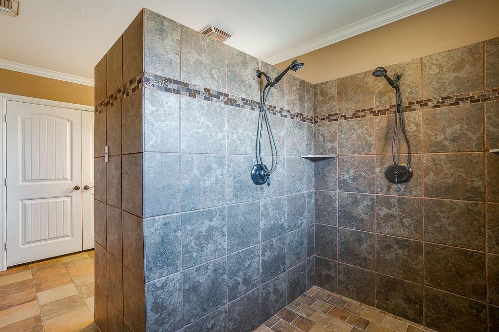 205 West Ridge Street Weatherford, TX 76086 - Photo 25 of 34 a bathroom with a shower