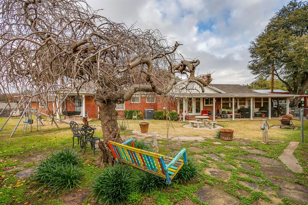 205 West Ridge Street Weatherford, TX 76086 - Photo 31 of 34 front view of a house with swimming pool and porch with furniture
