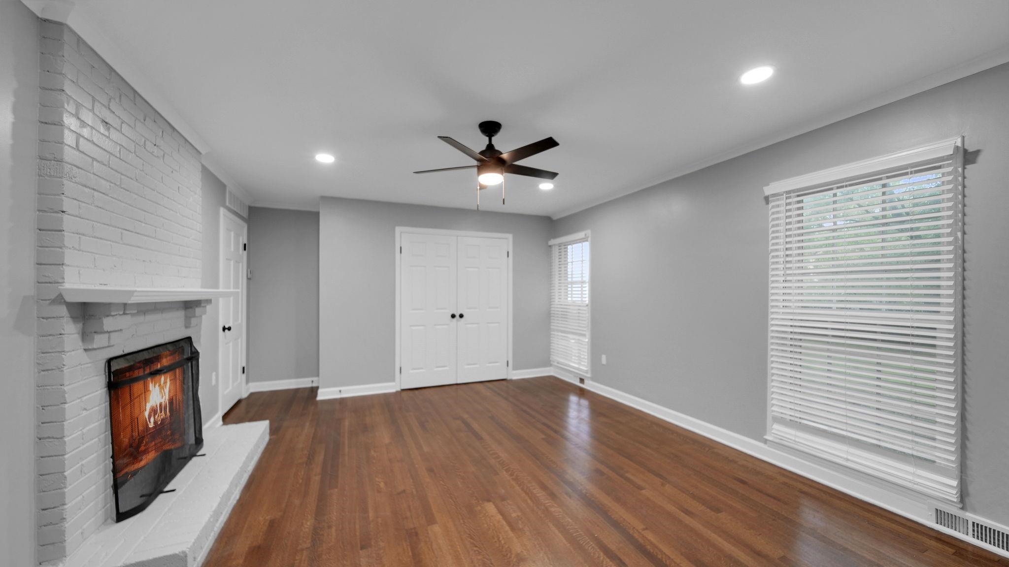 5256 Collingwood Road Memphis, TN 38117 - Photo 21 of 40 wooden floor in an empty room with a fireplace