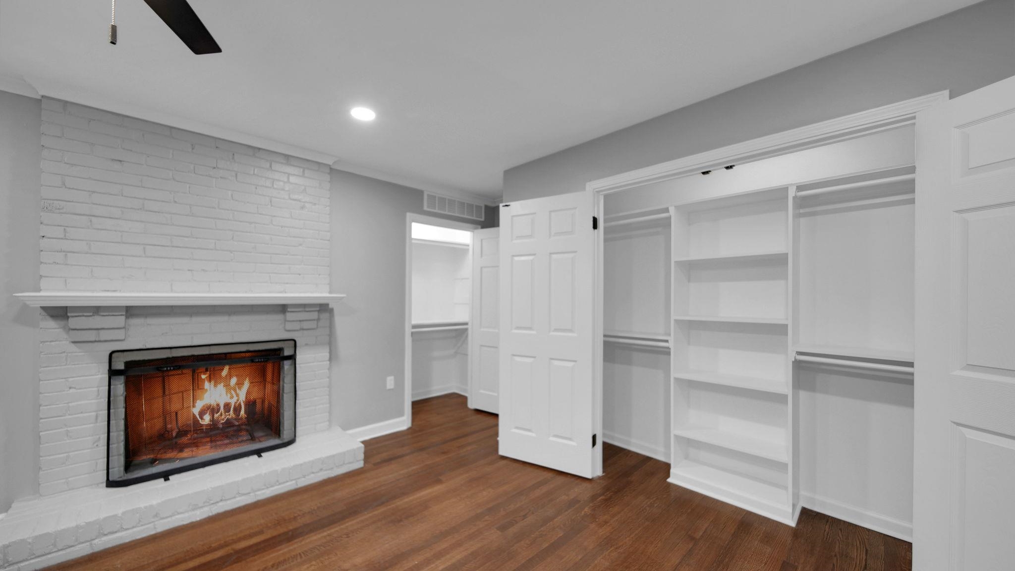 5256 Collingwood Road Memphis, TN 38117 - Photo 22 of 40 a room with a wooden floor and a fireplace