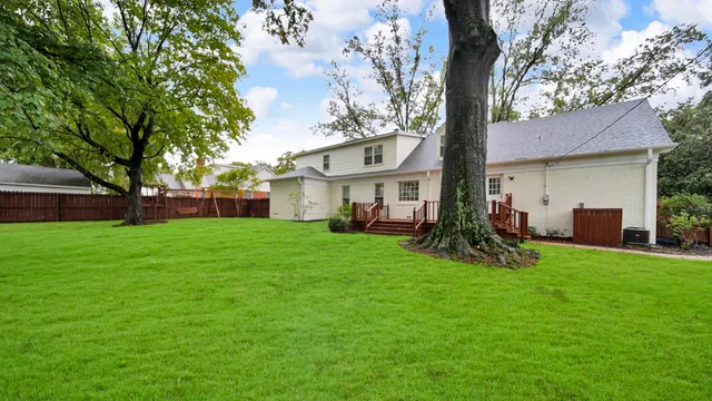a view of a house with a yard porch and sitting area