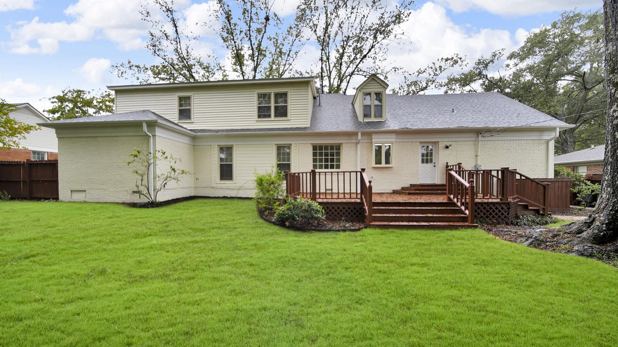 5256 Collingwood Road Memphis, TN 38117 - Photo 5 of 40 a view of a house with a backyard and a patio