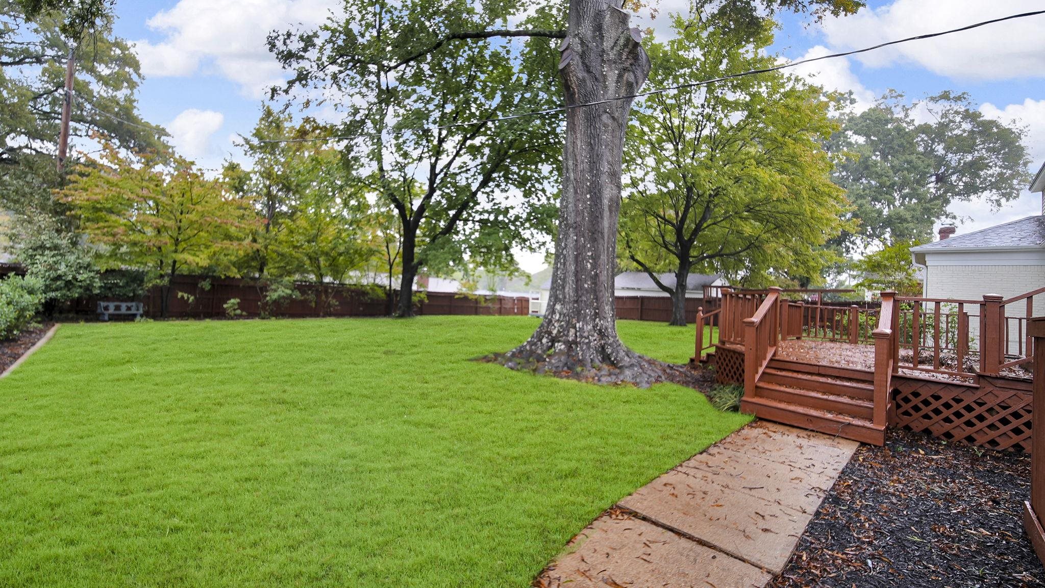 5256 Collingwood Road Memphis, TN 38117 - Photo 6 of 40 a park view with a bench in a garden