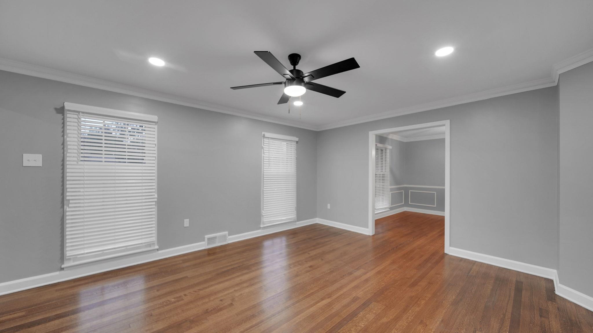 5256 Collingwood Road Memphis, TN 38117 - Photo 10 of 40 a view of an empty room with window and wooden floor
